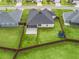 Aerial view of the home showcasing the backyard with a trampoline, and privacy fence at 3318 Dzuro Dr, Oxford, FL 34484