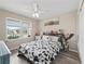 Bedroom featuring a cow print comforter and closet at 3318 Dzuro Dr, Oxford, FL 34484