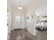 Hallway leading to a bedroom, with a view of the front door at 3318 Dzuro Dr, Oxford, FL 34484