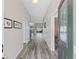 View of the hallway with lovely flooring, with a direct view of the home's backyard at 3318 Dzuro Dr, Oxford, FL 34484