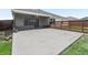 View of a screened-in patio with concrete flooring and a privacy fence at 3318 Dzuro Dr, Oxford, FL 34484