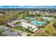 Overhead view of community amenities including pool, tennis, clubhouse, and parking at 4835 Kelso St, Leesburg, FL 34748