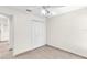 A clean bedroom featuring neutral walls and a tiled floor for a modern look at 4835 Kelso St, Leesburg, FL 34748