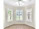 Sunny breakfast nook featuring plantation shutters and lots of natural light at 4835 Kelso St, Leesburg, FL 34748