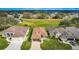 Aerial front view of a single-story home nestled in a community near a golf course and scenic views at 4835 Kelso St, Leesburg, FL 34748