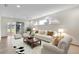 Bright and airy living room featuring contemporary furniture, a stylish rug and lots of natural light at 4835 Kelso St, Leesburg, FL 34748