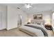 Stylized main bedroom featuring an ensuite bathroom and a serene ambiance at 4835 Kelso St, Leesburg, FL 34748