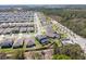 Expansive aerial view of a residential neighborhood featuring well-maintained homes and verdant landscaping at 5363 Timberland Ave, St Cloud, FL 34771