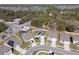 Wide aerial view of a home with solar panels, a fenced yard, and neighborhood surroundings at 5363 Timberland Ave, St Cloud, FL 34771