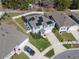 Aerial view of a home with solar panels, screened pool, and neatly maintained landscaping at 5363 Timberland Ave, St Cloud, FL 34771