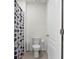 Cozy bathroom features a standard toilet and shower with a patterned curtain at 5363 Timberland Ave, St Cloud, FL 34771