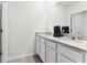 Modern bathroom featuring double sinks with granite countertops and ample mirror space at 5363 Timberland Ave, St Cloud, FL 34771