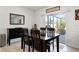 Dining room with dark wood furniture and sliding glass doors to screened porch at 5363 Timberland Ave, St Cloud, FL 34771