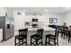 Bright kitchen featuring granite countertops, stainless steel appliances, pendant lighting, and island seating at 5363 Timberland Ave, St Cloud, FL 34771