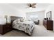 Inviting main bedroom features a king-size bed, neutral tones, and an abundance of natural light at 5363 Timberland Ave, St Cloud, FL 34771