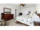 Tranquil main bedroom features a king-size bed and a dresser at 5363 Timberland Ave, St Cloud, FL 34771