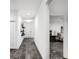 Hallway with hard floors and minimal decor leading to the main bedroom at 7193 Dilly Lake Ave, Groveland, FL 34736