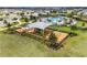 Overhead view of the community playground featuring slides and swings for children at 7193 Dilly Lake Ave, Groveland, FL 34736