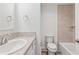Bathroom with single sink vanity and tub-shower with tile surround at 7315 Cornwall Way, The Villages, FL 34762