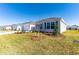 New home features manicured lawn and front garden at 7315 Cornwall Way, The Villages, FL 34762