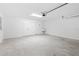 Spacious garage features ample room for parking and storage with utility sink at 7315 Cornwall Way, The Villages, FL 34762