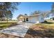 Charming single-story home with a covered porch and well-maintained lawn at 8230 Se 23Rd Dr, Webster, FL 33597