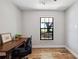 Home office setup with wood floors and a natural light window at 8230 Se 23Rd Dr, Webster, FL 33597