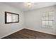 Bedroom featuring new floors, ceiling fan and a picture window at 8721 Se 159Th Pl, Summerfield, FL 34491