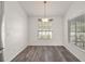 Bright dining area featuring modern lighting, and two windows for natural light at 8721 Se 159Th Pl, Summerfield, FL 34491