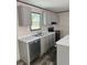 Well-lit kitchen features a sink under the window and stainless steel appliances at 909 Lake Thomas Rd, Lake Wales, FL 33898