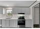 Kitchen featuring a stainless steel oven, light cabinets and countertops at 909 Lake Thomas Rd, Lake Wales, FL 33898