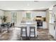 Modern kitchen with sleek white cabinetry, stainless steel appliances, and a center island at 909 Lake Thomas Rd, Lake Wales, FL 33898