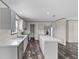 Well-lit kitchen with stainless steel appliances, an island and modern cabinetry at 909 Lake Thomas Rd, Lake Wales, FL 33898