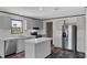 Modern kitchen featuring stainless steel appliances, light cabinets, and a center island at 909 Lake Thomas Rd, Lake Wales, FL 33898