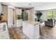 Open kitchen featuring an island, stainless steel appliances, and light granite countertops at 909 Lake Thomas Rd, Lake Wales, FL 33898