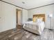 Bedroom featuring wood-look floors, and neutral decor at 909 Lake Thomas Rd, Lake Wales, FL 33898