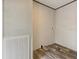 Utility room with wood-look floors and a large vent on the wall at 909 Lake Thomas Rd, Lake Wales, FL 33898