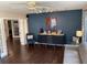 Interior shot of lounge with vinyl floors, navy accent wall and beverage bar at 911 N Donnelly St, Mount Dora, FL 32757