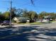 Street view showcasing a one story commercial building featuring well maintained lawn and elegant signage at 911 N Donnelly St, Mount Dora, FL 32757