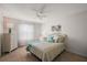 Bright bedroom with ceiling fan and wicker dresser showcasing natural light from a window at 9243 Se 171St Cooper Loop, The Villages, FL 32162