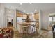 Well-lit kitchen featuring ample counter space and convenient breakfast bar seating at 9243 Se 171St Cooper Loop, The Villages, FL 32162