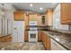 Spacious kitchen featuring stainless steel appliances, granite countertops, and plenty of cabinet space at 9243 Se 171St Cooper Loop, The Villages, FL 32162