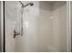 Clean and modern shower with white tiled walls, and seating at 9243 Se 171St Cooper Loop, The Villages, FL 32162