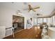 Spacious sunroom leads into dining area, featuring hardwood floors and lots of natural light at 9243 Se 171St Cooper Loop, The Villages, FL 32162