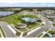 Aerial view of the community pool, playground, lake, and sidewalks in the Avalon Park neighborhood at 3040 Tansy St, Tavares, FL 32778