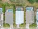 Aerial view of multiple homes with screened-in pools in a well-maintained residential neighborhood at 1007 Balmoral Dr, Davenport, FL 33896