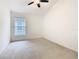 Bedroom featuring carpet flooring, a ceiling fan and a window with blinds at 1007 Balmoral Dr, Davenport, FL 33896