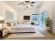 Bright main bedroom with a sliding glass door, white furniture, and a high ceiling at 1007 Balmoral Dr, Davenport, FL 33896