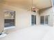 Covered patio featuring a ceiling fan and a view of the pool through the screened window at 1007 Balmoral Dr, Davenport, FL 33896