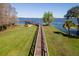 Aerial view of the dock and lake showing a beautiful lawn extending out to the water's edge at 11642 Martell Ct, Leesburg, FL 34788